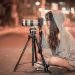 female photographer taking pictures at night