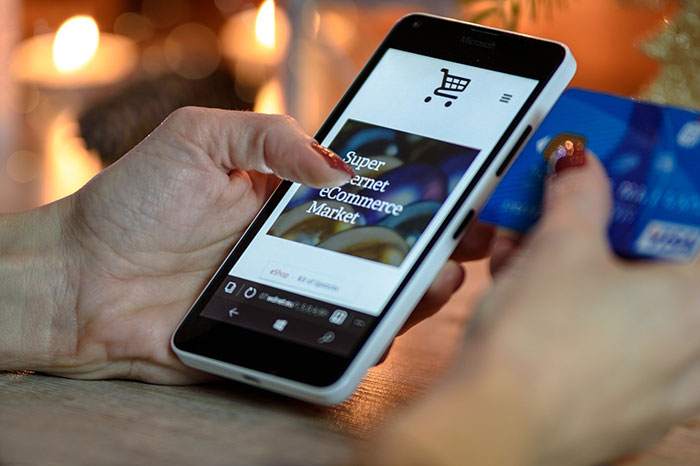 woman shopping online with phone